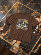 Maglia marrone Cianotic Occhio, solo capo sul tavolo in marmo del catalogo